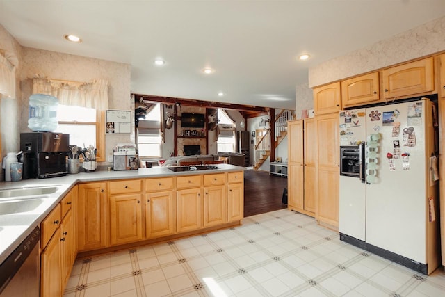 kitchen featuring stainless steel dishwasher, white refrigerator with ice dispenser, a peninsula, black electric stovetop, and light floors