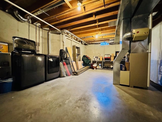 unfinished below grade area featuring separate washer and dryer