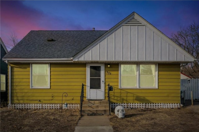 bungalow-style house featuring crawl space, entry steps, board and batten siding, and roof with shingles