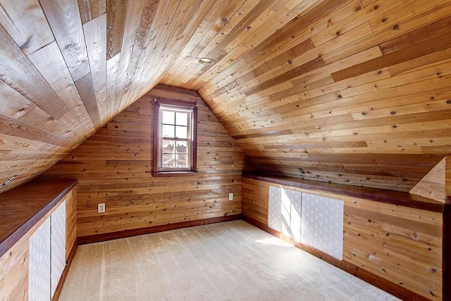 bonus room featuring wooden walls, wooden ceiling, carpet, and vaulted ceiling