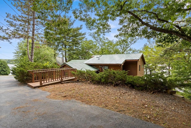 view of side of property with metal roof