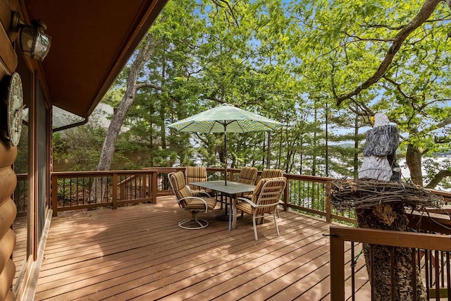 wooden deck featuring outdoor dining space