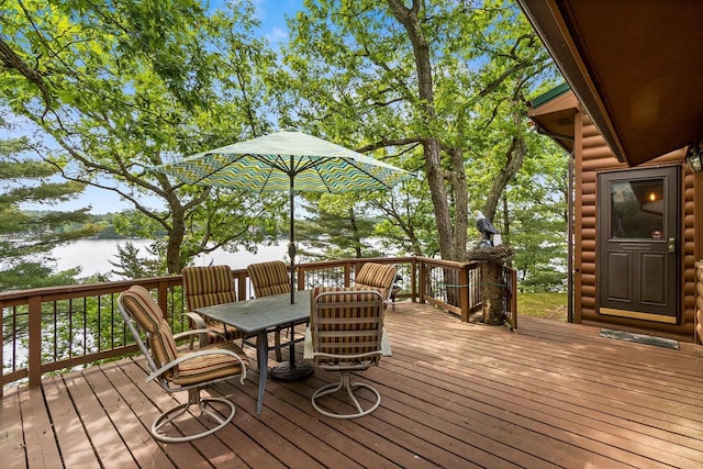 wooden deck featuring a water view