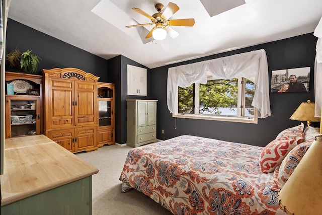 bedroom featuring ceiling fan, lofted ceiling, and carpet floors