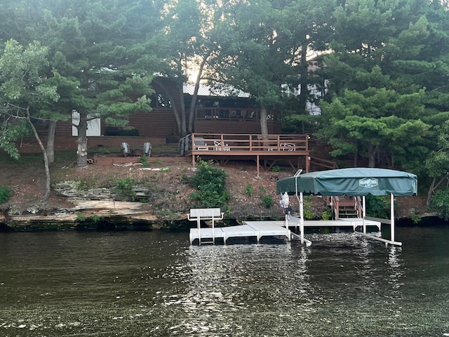 view of dock with a deck with water view