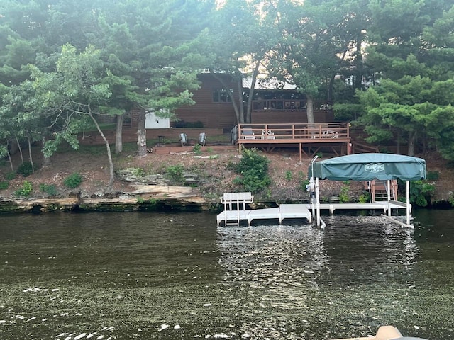 dock area with a deck with water view