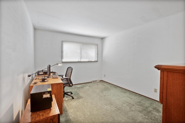 office with baseboards and carpet floors