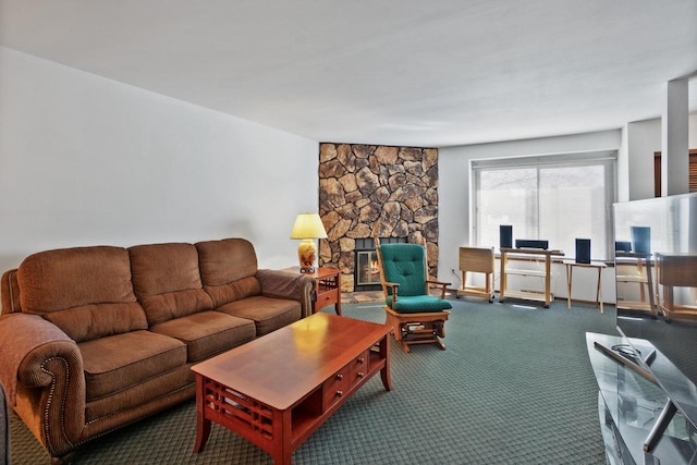 carpeted living room with a stone fireplace