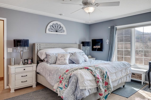 bedroom with ceiling fan and wood finished floors