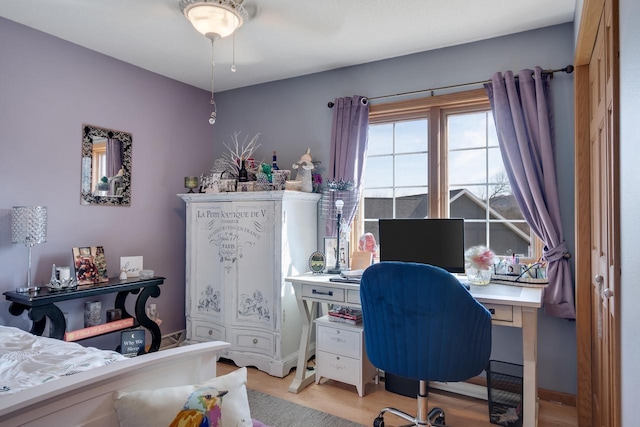 bedroom featuring light wood-type flooring and baseboards