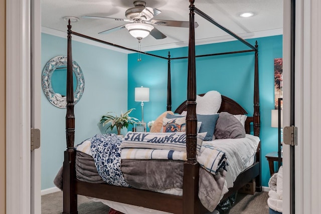 bedroom with ceiling fan, baseboards, crown molding, and carpet