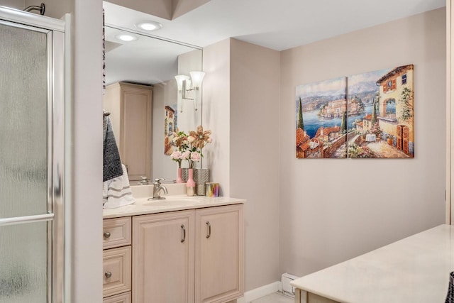 bathroom with baseboards and vanity