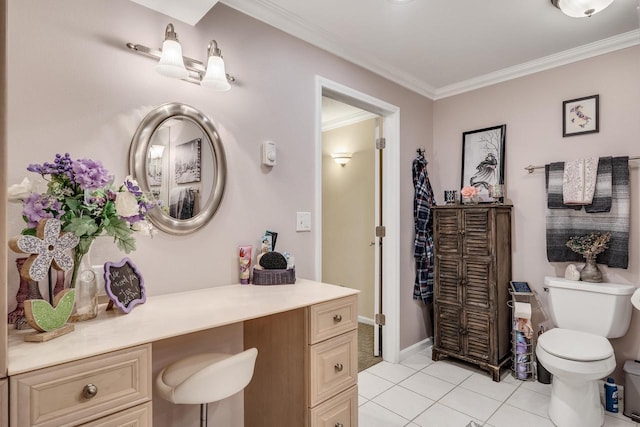 bathroom with tile patterned flooring, crown molding, baseboards, toilet, and vanity