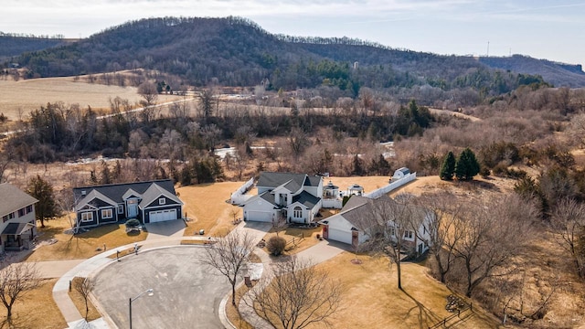 bird's eye view featuring a forest view and a mountain view