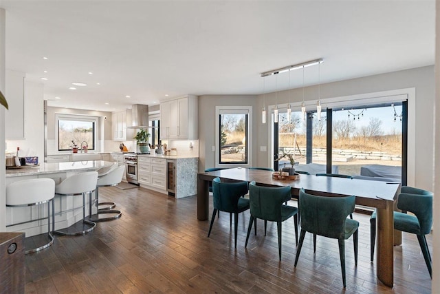 dining area featuring recessed lighting and dark wood finished floors