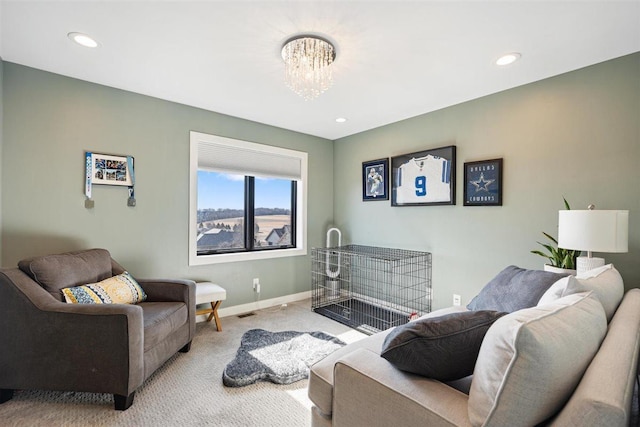 living area with recessed lighting, baseboards, carpet floors, and a chandelier