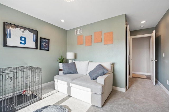 carpeted living room featuring visible vents, recessed lighting, and baseboards