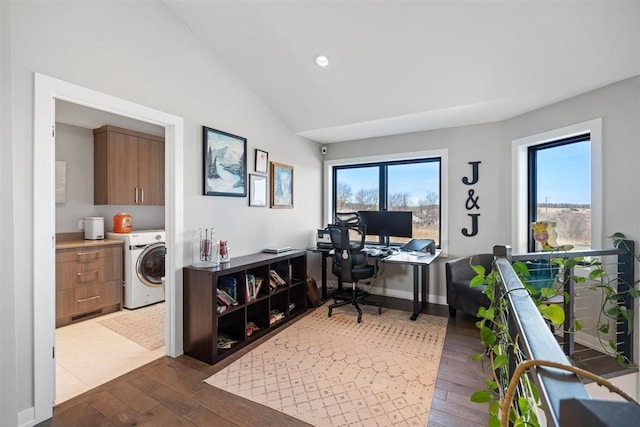 office featuring baseboards, washer / dryer, recessed lighting, hardwood / wood-style flooring, and vaulted ceiling