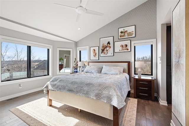 bedroom with visible vents, multiple windows, and dark wood-type flooring