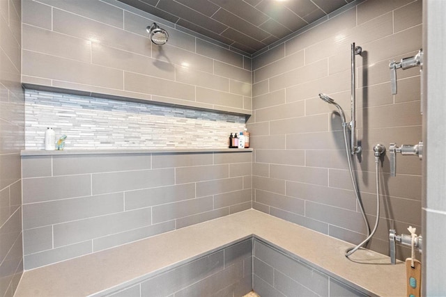 full bathroom with a tile shower