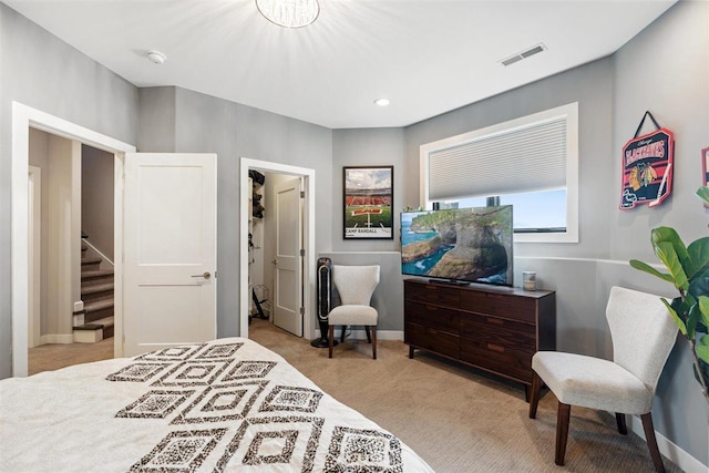 bedroom featuring visible vents, baseboards, and carpet