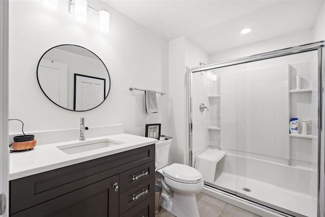 full bathroom with vanity, tile patterned floors, toilet, and a stall shower