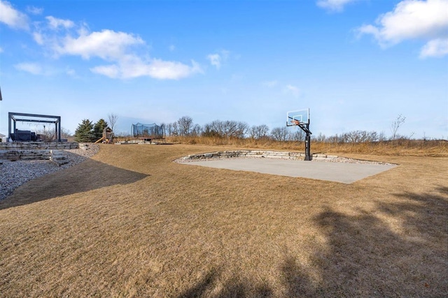 view of yard with community basketball court