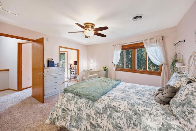 bedroom with ceiling fan, carpet, visible vents, and baseboards