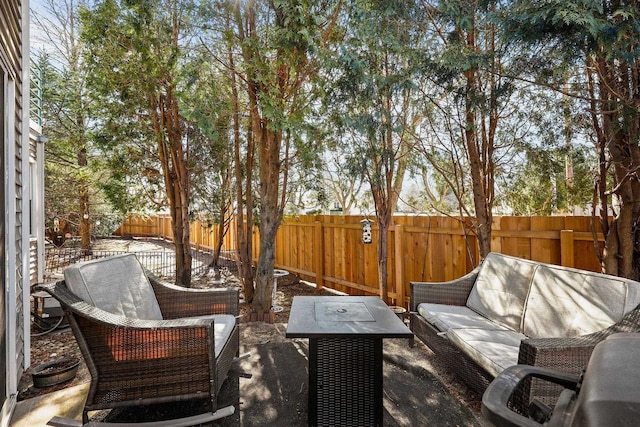 view of patio with an outdoor living space and a fenced backyard