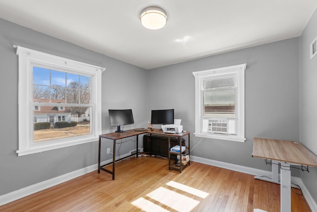 office area featuring baseboards and hardwood / wood-style floors