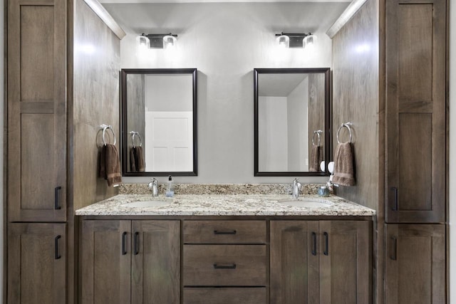 full bathroom featuring double vanity and a sink