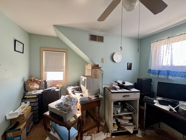 office with a wealth of natural light, visible vents, and ceiling fan