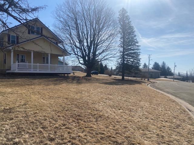 view of yard featuring covered porch