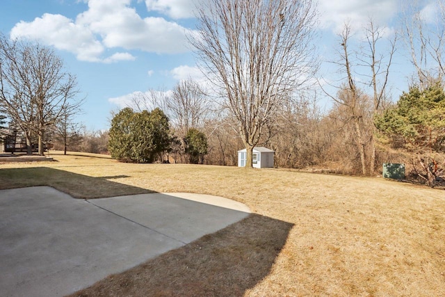 view of yard with an outbuilding and a shed