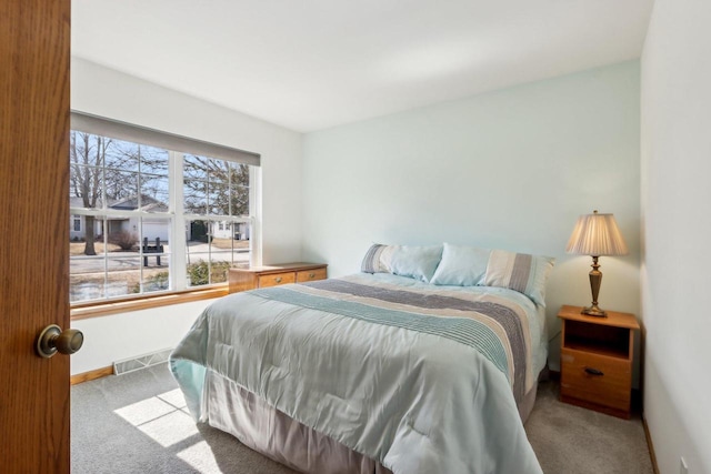 bedroom featuring carpet, visible vents, and baseboards