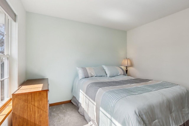 bedroom featuring carpet flooring and baseboards