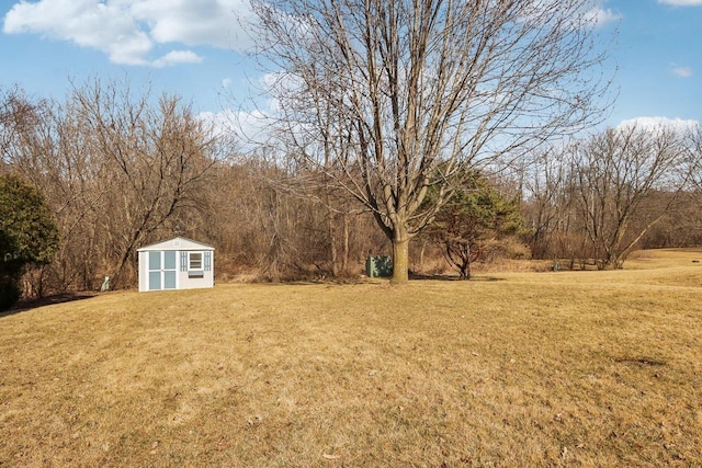 view of yard featuring an outbuilding and a storage shed