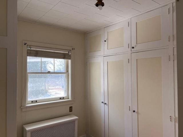 closet featuring radiator heating unit