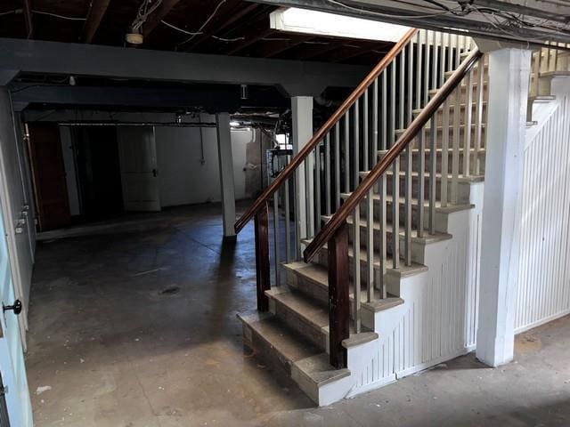 unfinished below grade area featuring stairs