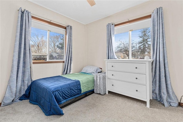 carpeted bedroom with ceiling fan