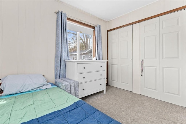 bedroom with a closet and carpet floors