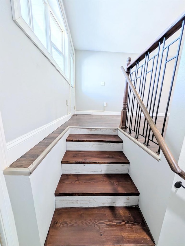 stairs with wood finished floors