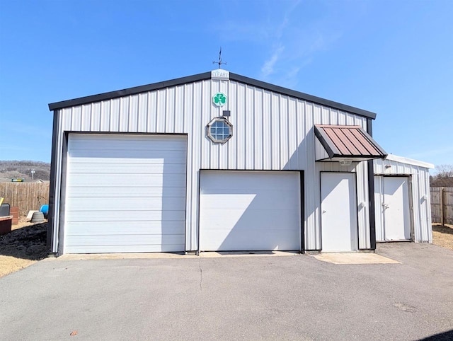 detached garage with fence