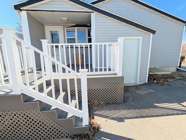 doorway to property featuring covered porch