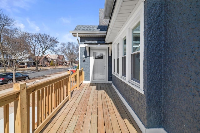 wooden terrace with a residential view