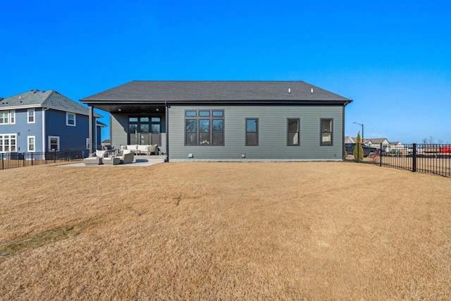 back of property featuring outdoor lounge area, a patio, a lawn, and a fenced backyard