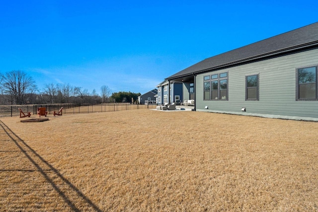 view of yard featuring a patio and fence