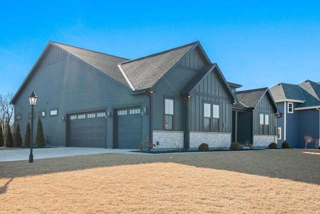 view of front facade featuring a front yard and board and batten siding