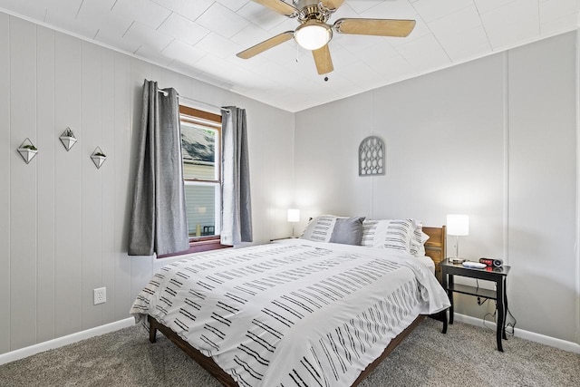 carpeted bedroom with a ceiling fan and baseboards