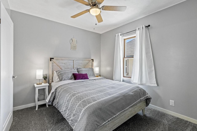 carpeted bedroom with ceiling fan and baseboards